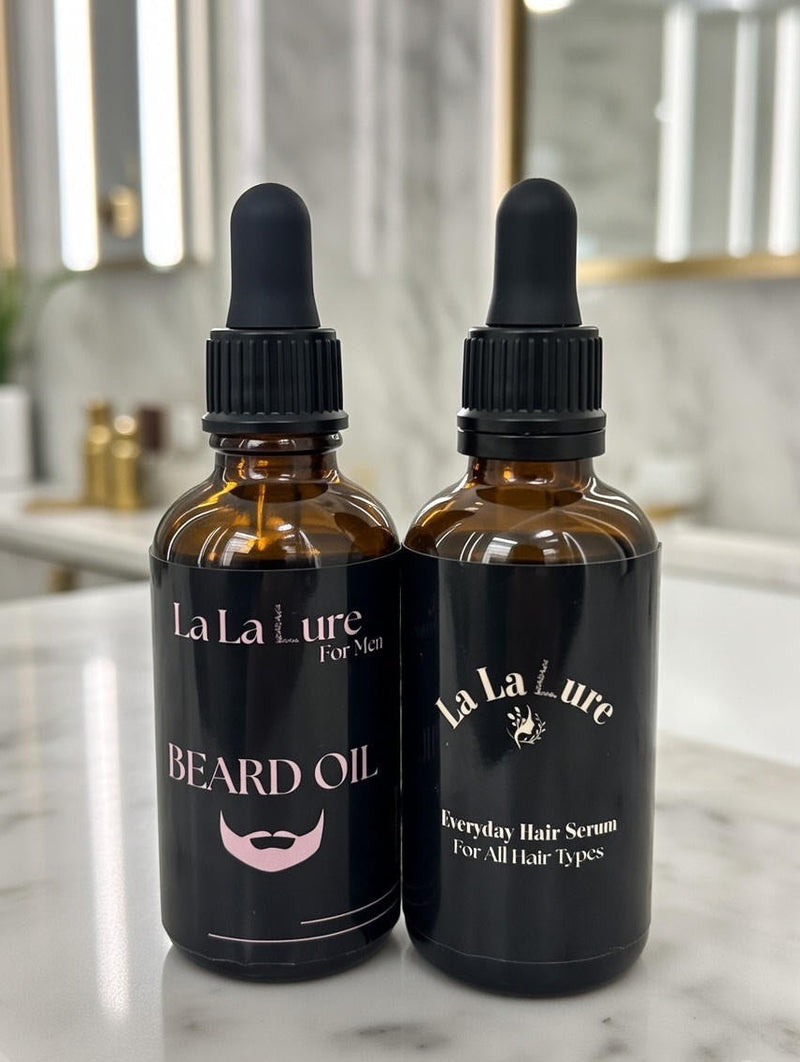 Two bottles of La La Lure hair care products on a marble surface.